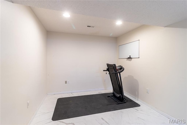 16910 Lawrence Dr, Saint Robert, MO 65584 - workout room featuring marble look tiles and recessed lighting