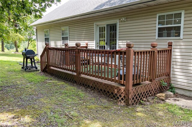 16910 Lawrence Dr, Saint Robert, MO 65584 - wooden deck with grilling area and a lawn