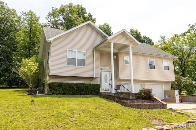 16910 Lawrence Dr, Saint Robert, MO 65584 - raised ranch featuring an attached garage and a front yard