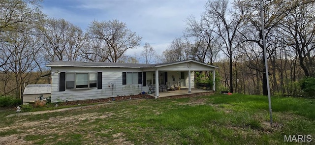 4598 Schenk Rd, Barnhart, MO 63012 - view of front of house featuring a porch and a front yard