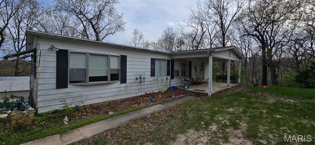 4598 Schenk Rd, Barnhart, MO 63012 - view of front of house featuring a porch