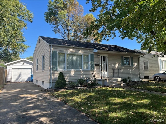 1717 Spring Ave, Granite City, IL 62040 - bungalow-style house with an outdoor structure, asphalt driveway, a front lawn, and a garage