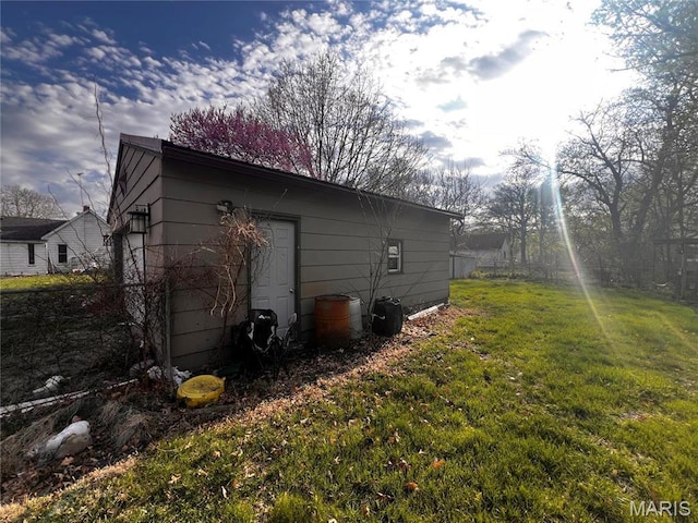 view of property exterior featuring a lawn