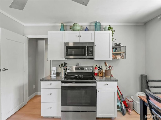 2822 State Rd W, Eureka, MO 63025 - kitchen with appliances with stainless steel finishes, white cabinets, light wood-style flooring, baseboards, and ornamental molding