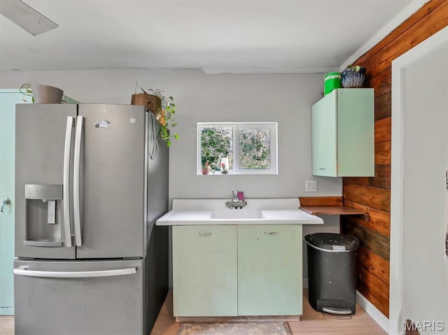 2822 State Rd W, Eureka, MO 63025 - kitchen with stainless steel fridge, light wood finished floors, light countertops, and green cabinetry