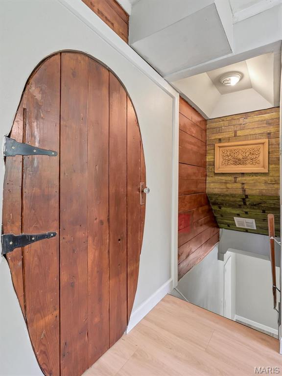2822 State Rd W, Eureka, MO 63025 - interior space featuring wood walls, light wood-style floors, and vaulted ceiling