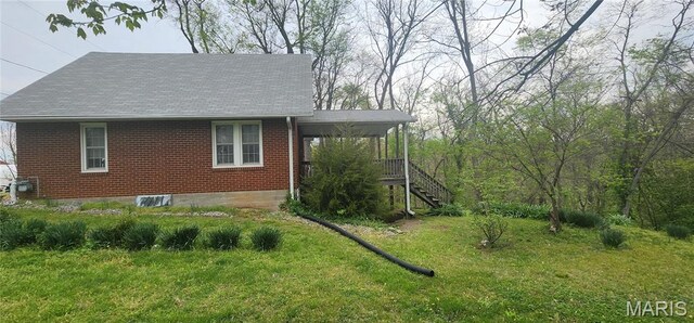 500 Church St, Chester, IL 62233 - view of property exterior with brick siding, stairway, a lawn, and a porch