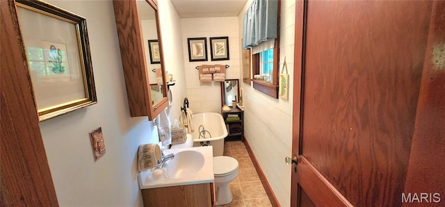 500 Church St, Chester, IL 62233 - bathroom featuring toilet, tile patterned floors, healthy amount of natural light, and vanity