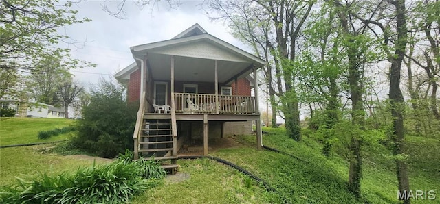 500 Church St, Chester, IL 62233 - back of property with stairs, a lawn, and a wooden deck