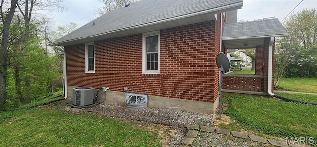 500 Church St, Chester, IL 62233 - view of property exterior featuring cooling unit, brick siding, a yard, and roof with shingles