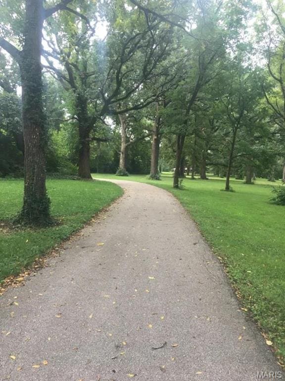 4230 Marlin Dr, Saint Louis, MO 63121 - view of community with a yard and asphalt driveway