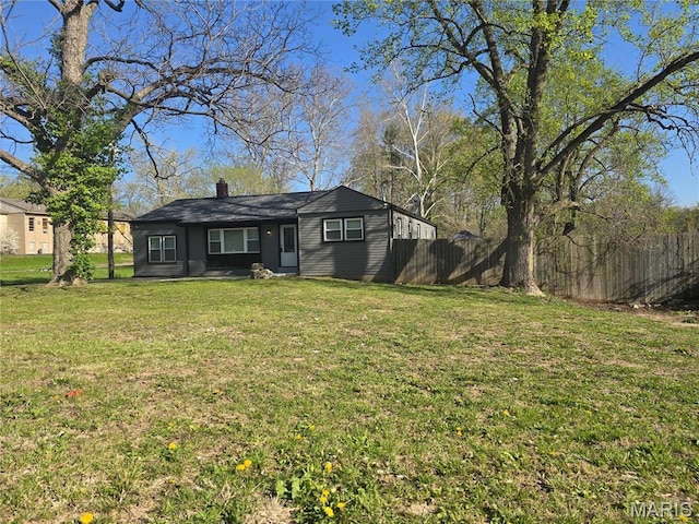 view of front of house featuring a chimney