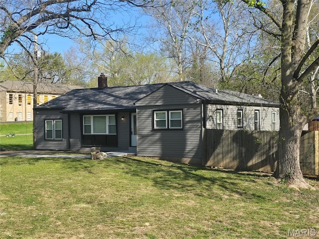 view of front of home with a chimney