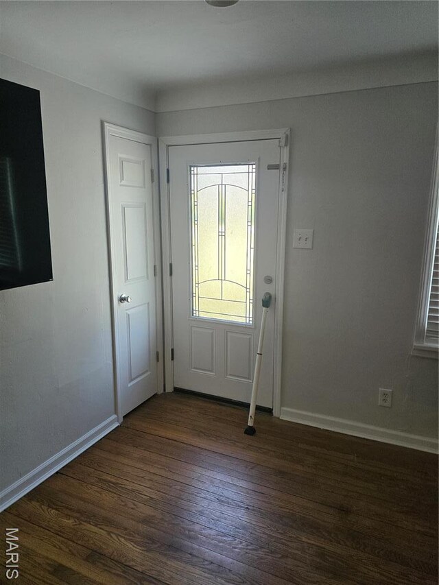 entrance foyer with baseboards and dark wood-style flooring