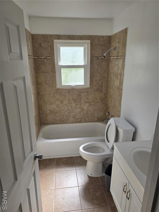 full bathroom featuring toilet, shower / tub combination, vanity, and tile patterned flooring