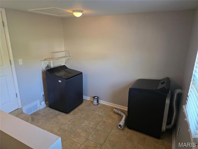 laundry room with baseboards