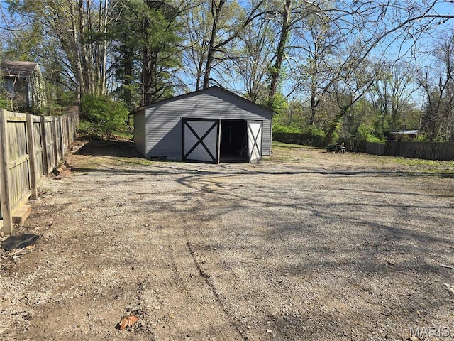 view of shed with fence