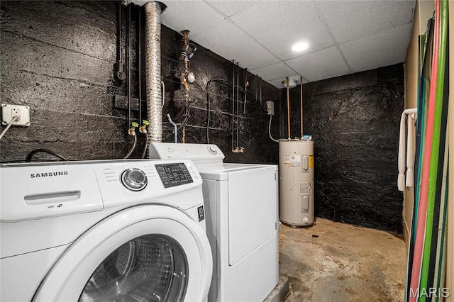 laundry area featuring water heater and washing machine and dryer