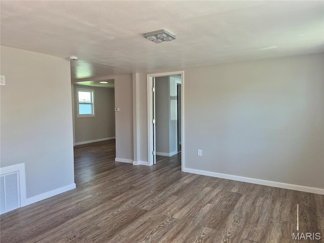2205 Miracle Ave, Granite City, IL 62040 - empty room with dark wood-style floors and baseboards