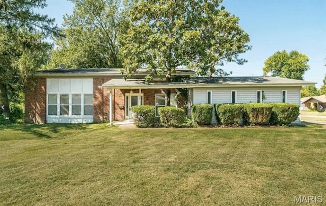 698 Carriage Ln, Hazelwood, MO 63042 - view of front of property with a front lawn and brick siding