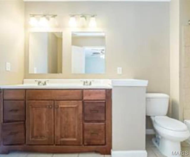698 Carriage Ln, Hazelwood, MO 63042 - bathroom with toilet and double vanity