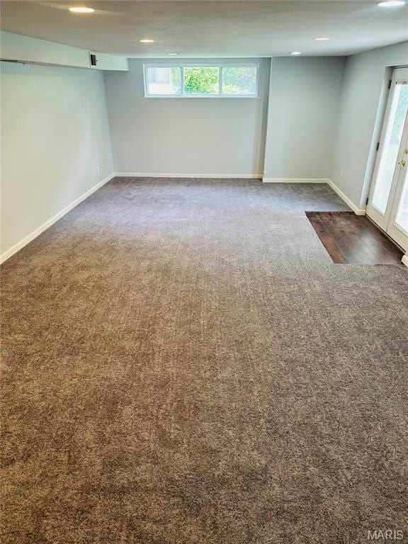 698 Carriage Ln, Hazelwood, MO 63042 - basement with carpet flooring, plenty of natural light, and baseboards