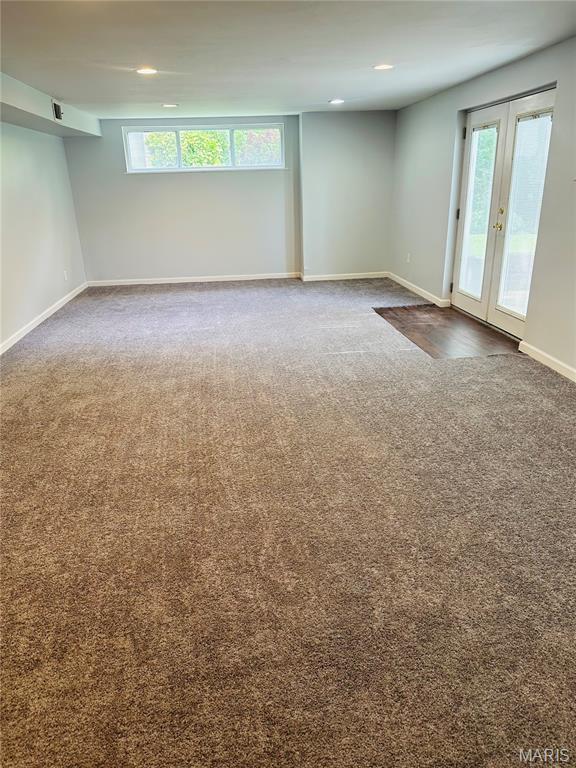 698 Carriage Ln, Hazelwood, MO 63042 - carpeted spare room featuring baseboards, french doors, and recessed lighting