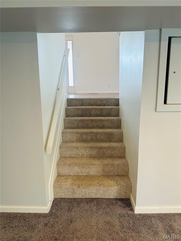 698 Carriage Ln, Hazelwood, MO 63042 - stairs featuring carpet flooring and baseboards