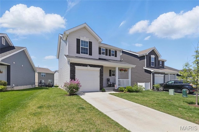 view of front of property featuring an attached garage, covered porch, a front lawn, and driveway