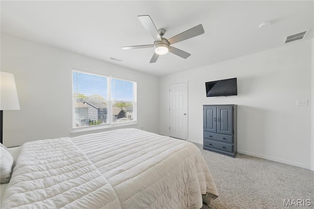 bedroom with baseboards, carpet floors, and a ceiling fan