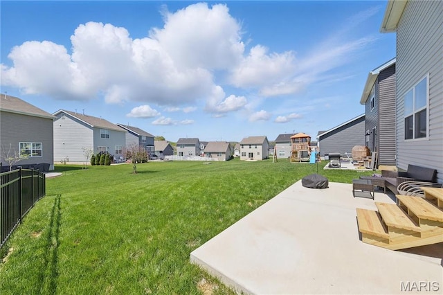view of yard featuring a residential view, a patio area, and an outdoor hangout area