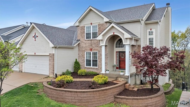 535 Vista Hills Ct, Eureka, MO 63025 - traditional home featuring driveway, a shingled roof, brick siding, and an attached garage