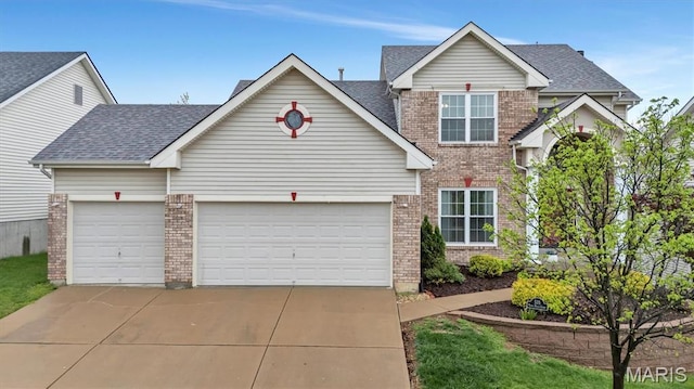 535 Vista Hills Ct, Eureka, MO 63025 - traditional-style house with brick siding, concrete driveway, an attached garage, and a shingled roof