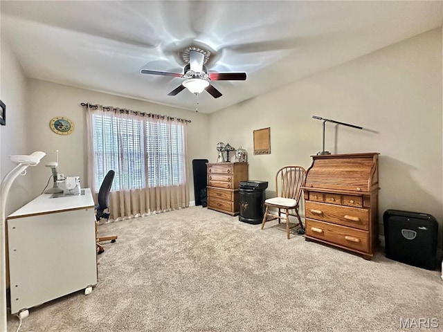 office area with carpet and a ceiling fan