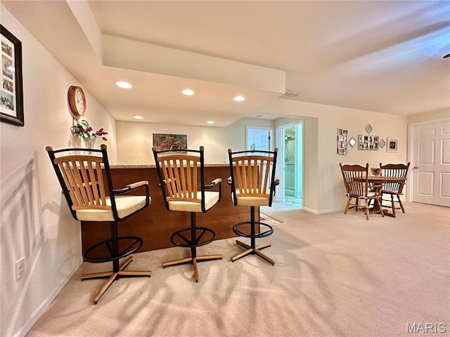 dining space featuring baseboards, carpet, and recessed lighting