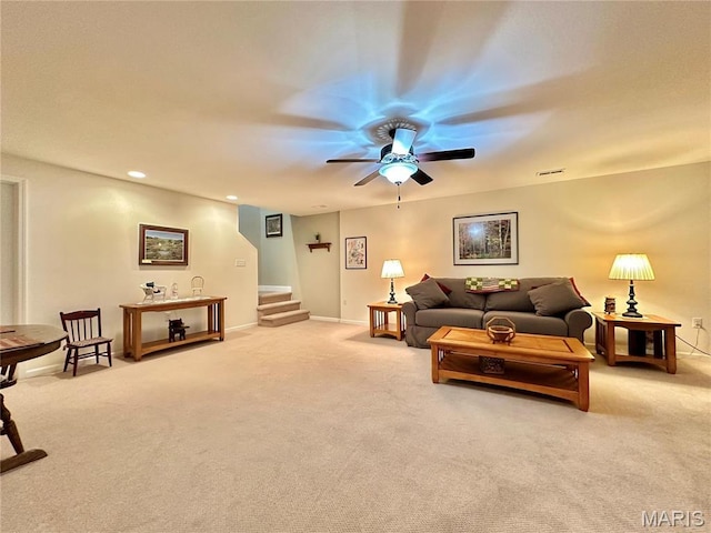 living room featuring carpet, stairway, ceiling fan, baseboards, and recessed lighting