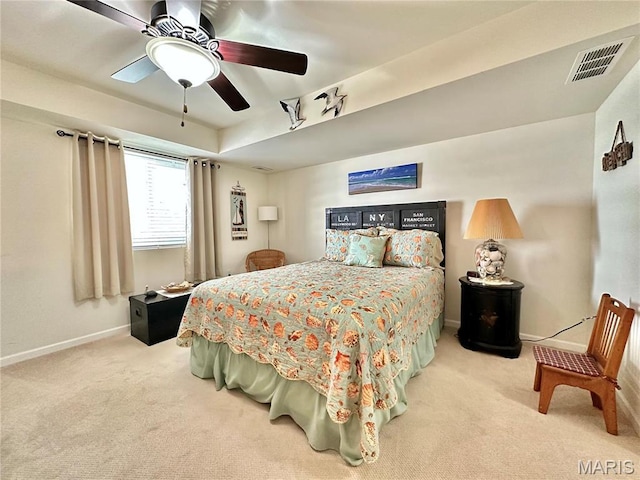 bedroom with carpet flooring, baseboards, and a ceiling fan