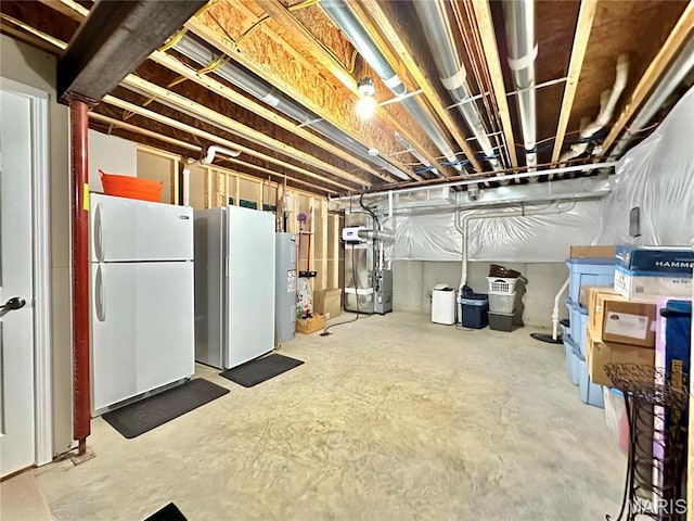 unfinished basement with freestanding refrigerator, water heater, and heating unit