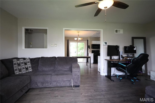 90 La Sierra Dr, Florissant, MO 63031 - living room with wood finished floors, a chandelier, a desk, ceiling fan, and baseboards