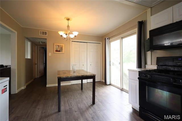 90 La Sierra Dr, Florissant, MO 63031 - kitchen with black appliances, a chandelier, dark wood finished floors, and white cabinets
