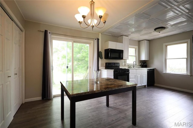 90 La Sierra Dr, Florissant, MO 63031 - kitchen featuring black appliances, a chandelier, plenty of natural light, a sink, and an ornate ceiling