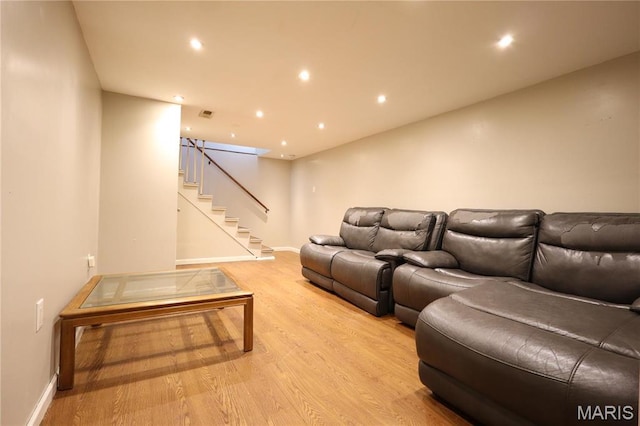 90 La Sierra Dr, Florissant, MO 63031 - living area featuring light wood-style flooring, stairs, baseboards, and recessed lighting