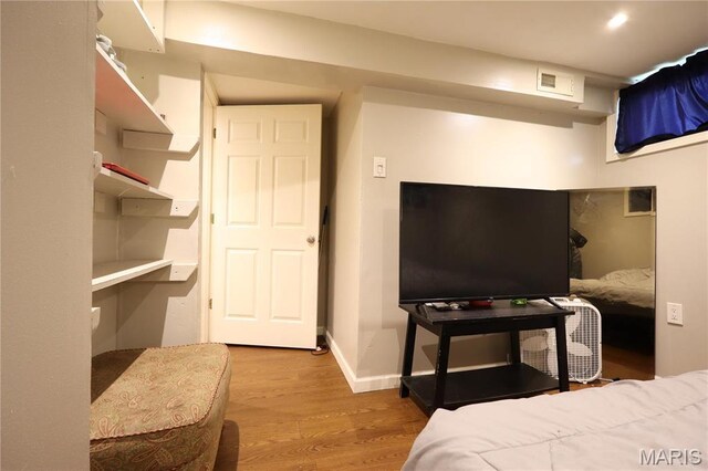 90 La Sierra Dr, Florissant, MO 63031 - bedroom with wood finished floors and baseboards