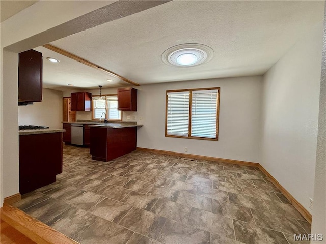 kitchen featuring baseboards, a peninsula, dishwasher, a sink, and open floor plan