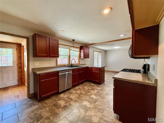 kitchen with dishwasher, a sink, a peninsula, recessed lighting, and baseboards