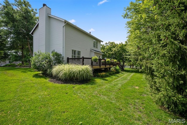 35 Heatherwood Ct, Ofallon, MO 63368 - view of side of home with a chimney, a deck, and a yard