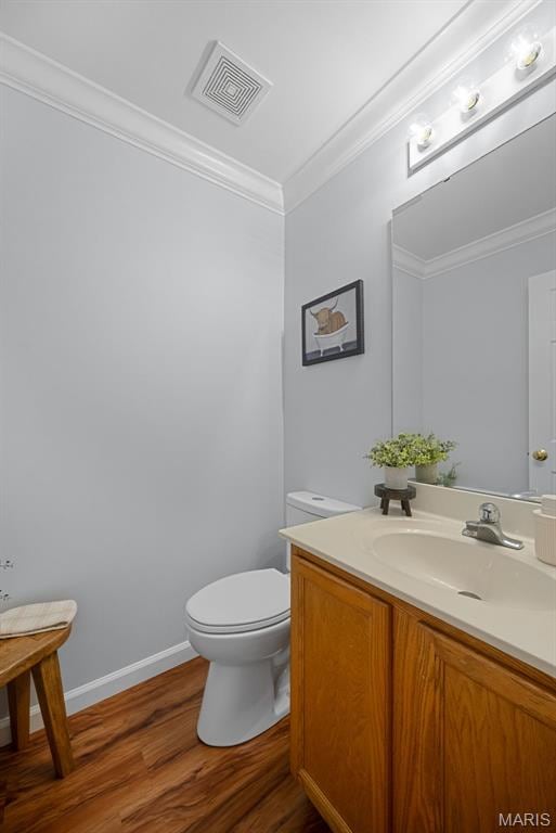 35 Heatherwood Ct, Ofallon, MO 63368 - half bath featuring crown molding, wood finished floors, and vanity