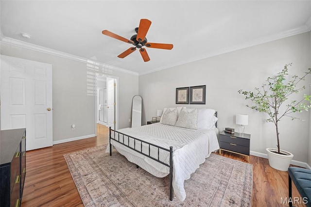 35 Heatherwood Ct, Ofallon, MO 63368 - bedroom with wood finished floors, ornamental molding, a ceiling fan, and ensuite bathroom