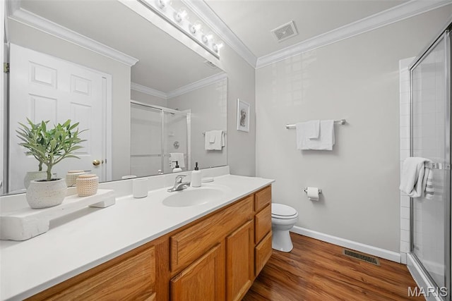 35 Heatherwood Ct, Ofallon, MO 63368 - bathroom featuring a stall shower, vanity, ornamental molding, and wood finished floors