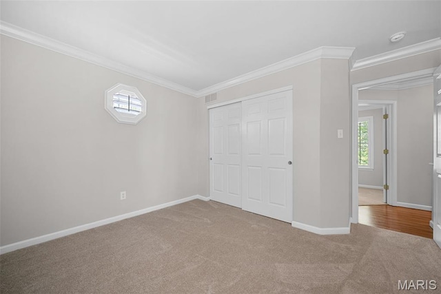 35 Heatherwood Ct, Ofallon, MO 63368 - unfurnished bedroom featuring carpet flooring, ornamental molding, and a closet